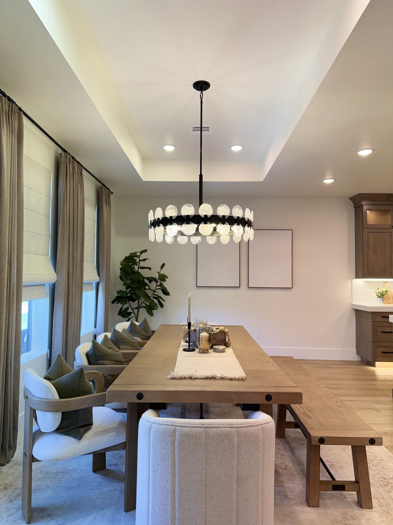 Dining room with elegant chandelier and natural light